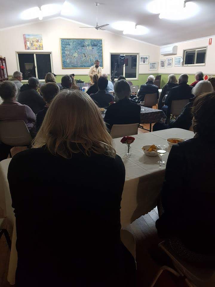 An audience gathered for a Ukulele Russ performance