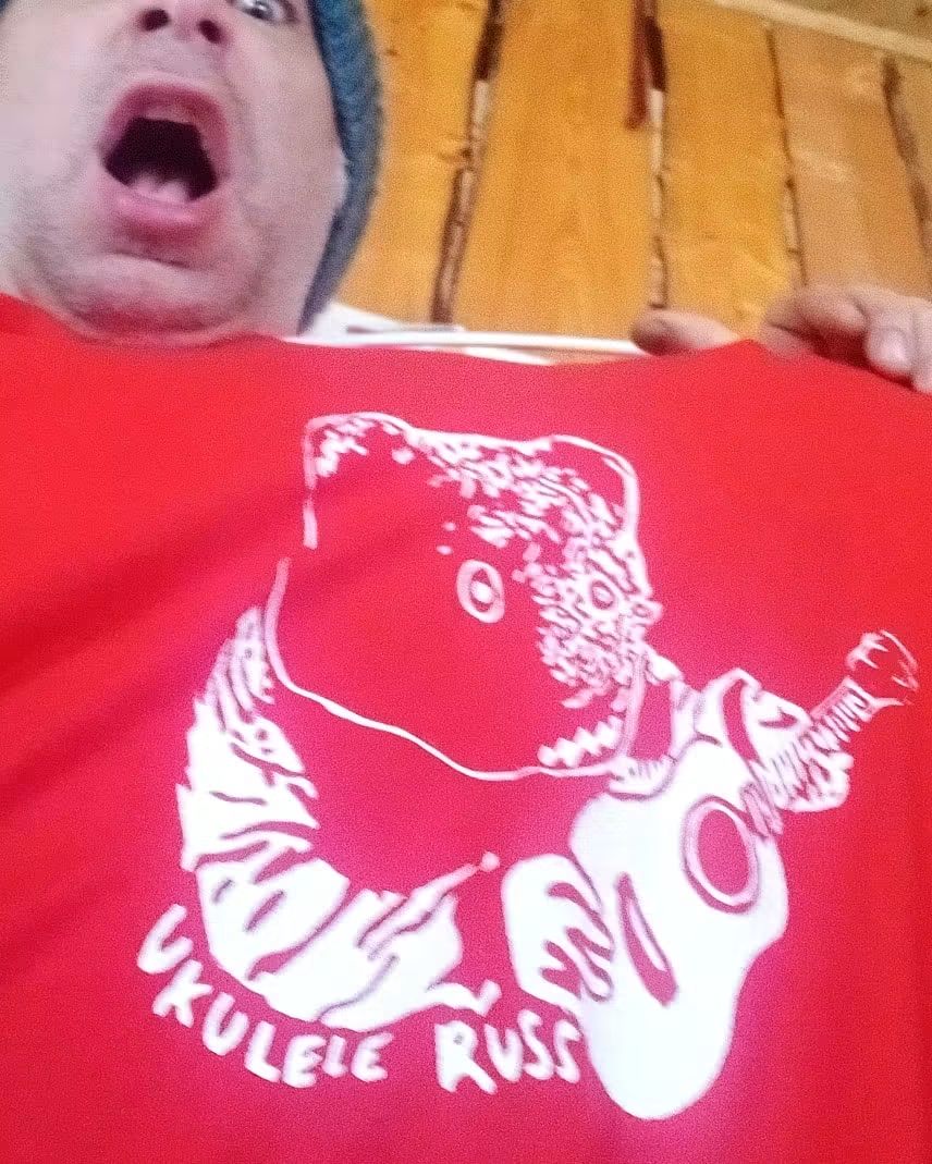 Close view of the moose design on a red Ukulele Russ shirt