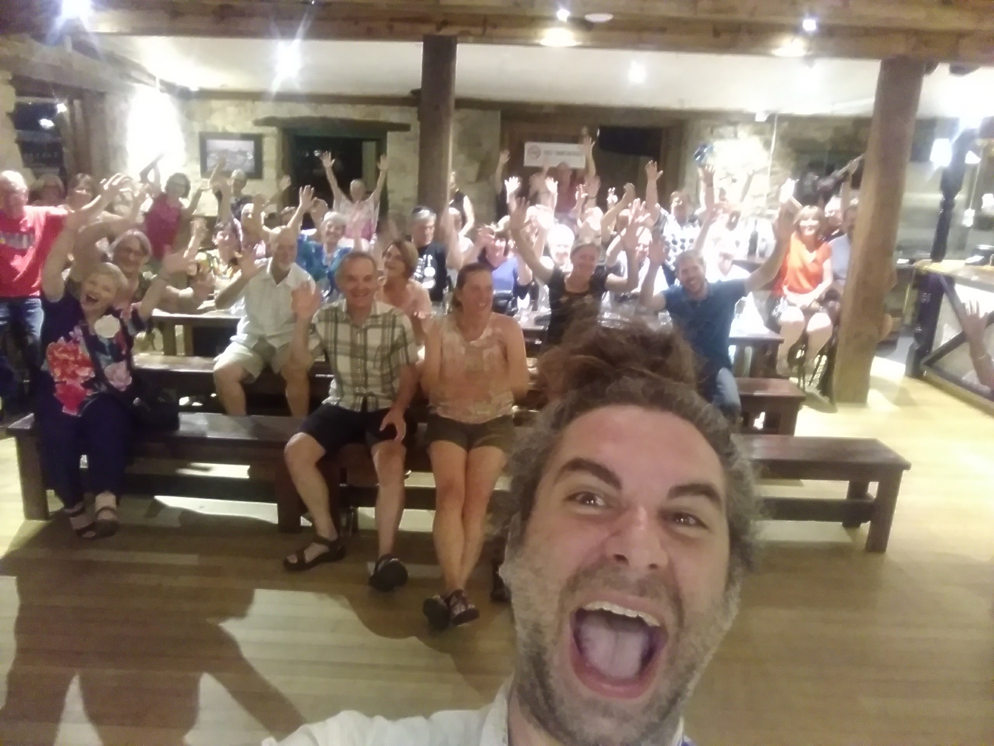 Happy audience waving after a Ukulele Russ performance